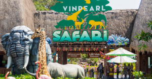 Entrance to Vinpearl Safari with large animal statues (elephant and giraffe) and a bright Safari sign above the entrance.